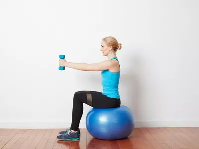 woman doing front raise tricep extension