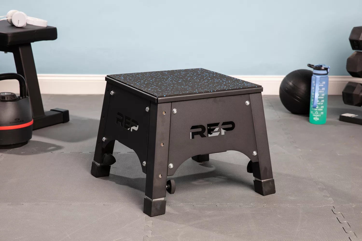 Rep Fitness Fully Assembled Adjustable Height Plyo Box on floor near fitness equipment