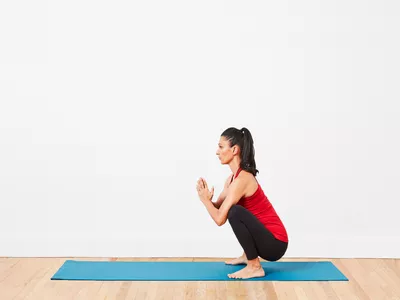 woman doing garland pose