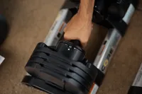 Hand holding Core Home Fitness Twistlock Dumbells