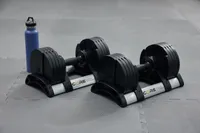 Core Home Fitness Twistlock Dumbells on stands set on gray mat