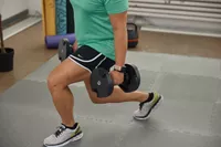Person exercising with the Nuobell Adjustable Dumbbells