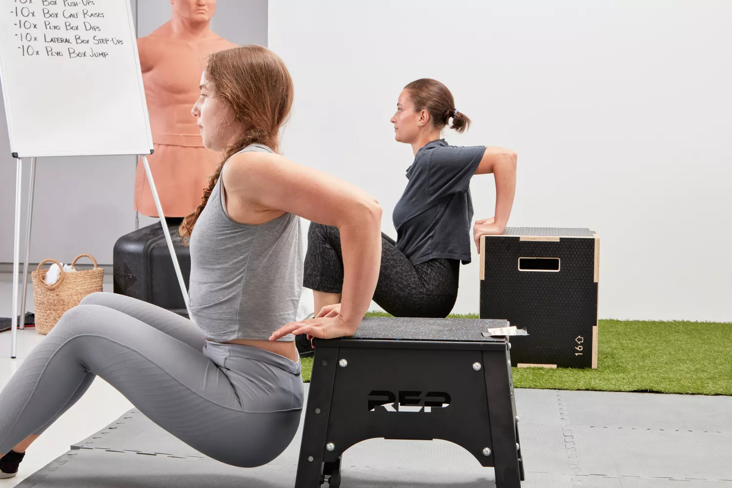 People doing dips off the side of plyo boxes