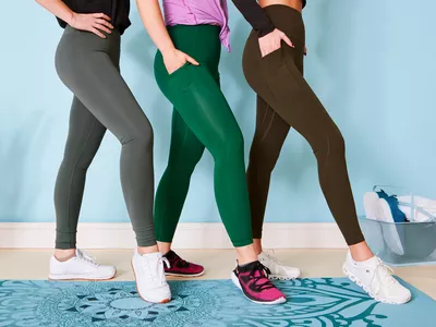 A group of people wearing lululemon leggings on a yoga mat