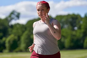 close up of woman running on a trail