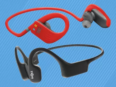 Two pairs of swimming headphones on a blue background