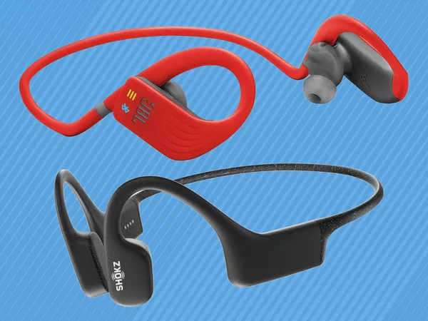 Two pairs of swimming headphones on a blue background