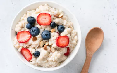 Oatmeal served with berries and almonds