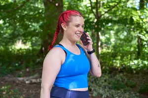 woman talking on phone with exercising