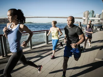 group running by water