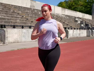 Woman running on a track
