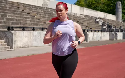 Woman running on a track