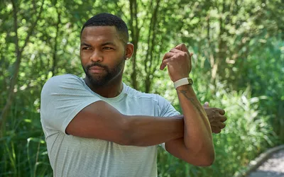 man stretching arms and shoulders