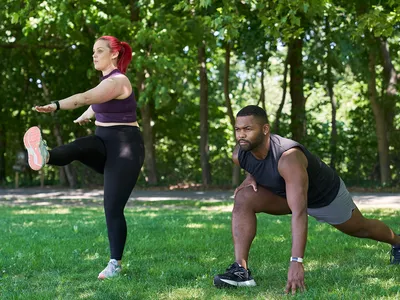 man and woman doing a warm up and cool down