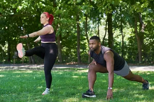man and woman doing a warm up and cool down