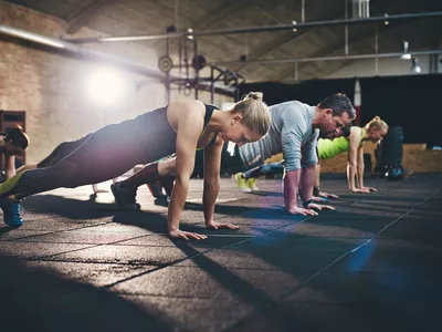 Group of adults doing push up exercises