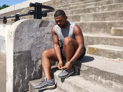 Man lacing up his shoes