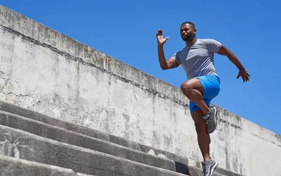 Man doing high knees