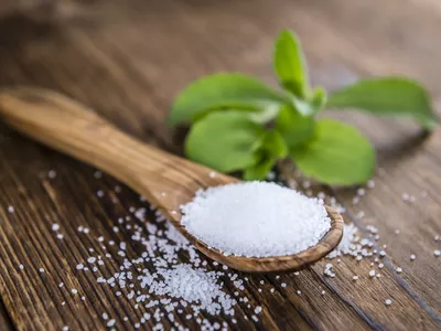 Old wooden table with Stevia Granules (selective focus)