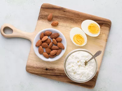 group of protein sources including eggs, almonds, and cottage cheese