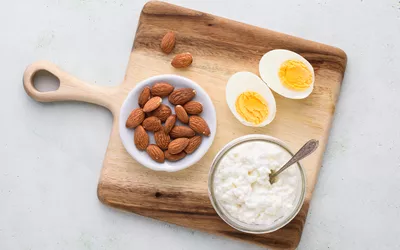 group of protein sources including eggs, almonds, and cottage cheese