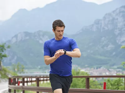 runner looking at watch