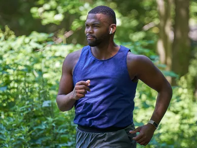man running with earbuds