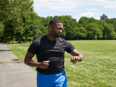 Man checking fitness tracker