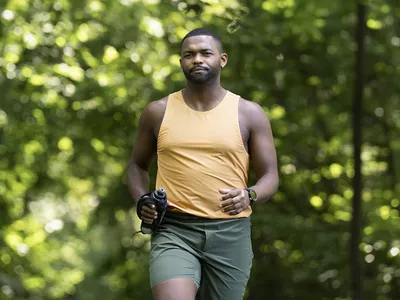 man jogging with a water bottle