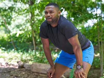 Man catching his breathe after a run