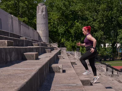 Woman running up stairs