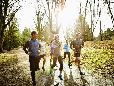 Group of people running on a trail