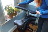 Person setting up Flexispot Home Office Height Adjustable Cycle Desk Bike