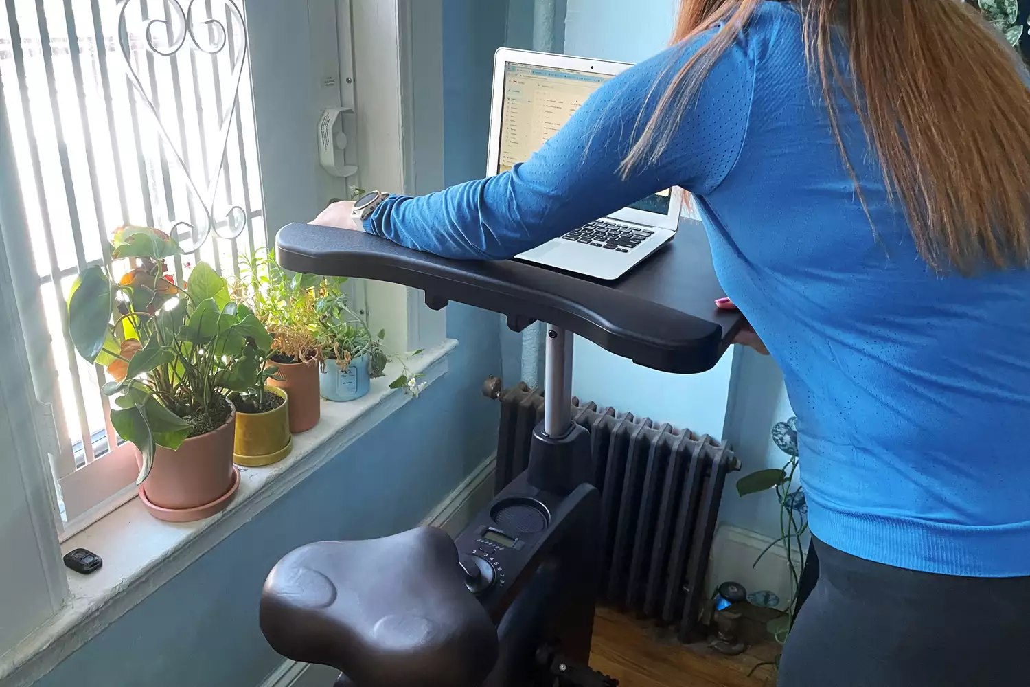 Person setting up Flexispot Home Office Height Adjustable Cycle Desk Bike
