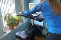 Person setting up Flexispot Home Office Height Adjustable Cycle Desk Bike