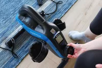 Person turning knob on LifePro FlexCycle Exercise Bike