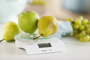 Fresh fruits on weight scale