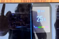 A person takes a close-up photo of the Renpho Elis Nova Smart Scale