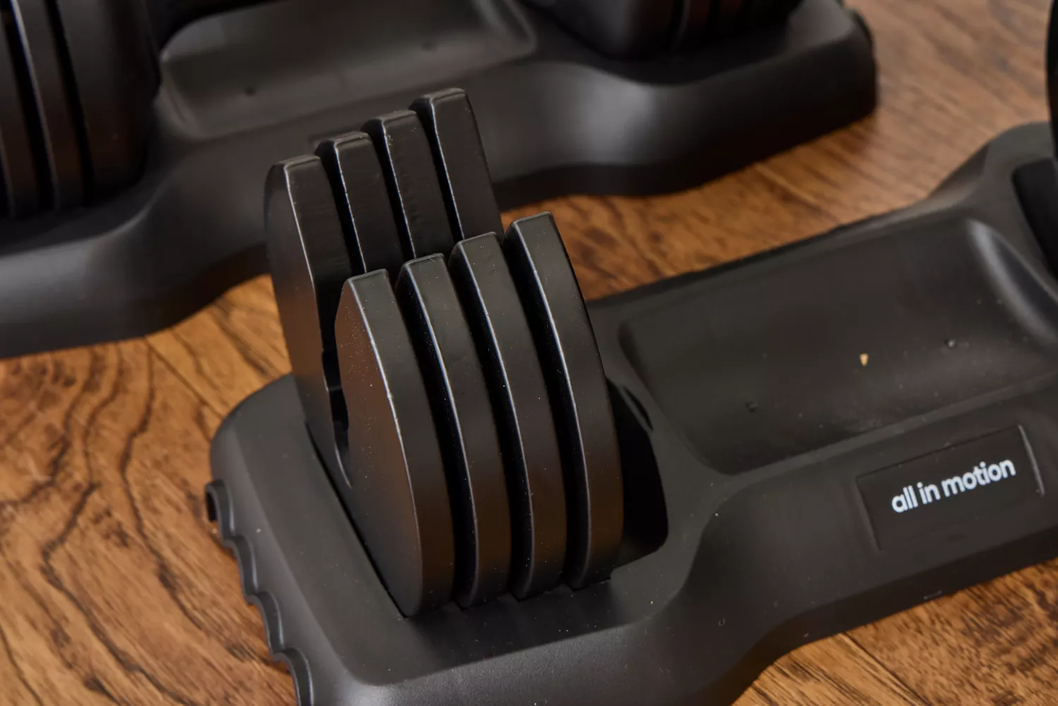 The All in Motion 25 lb Adjustable Dumbbell weight attachments and base