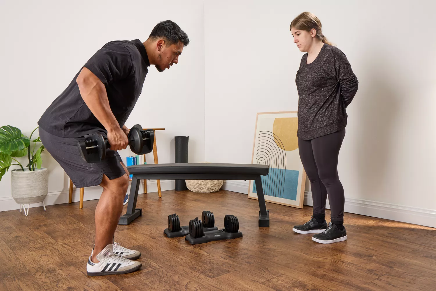A person lifts the All in Motion 25 lb Adjustable Dumbbell