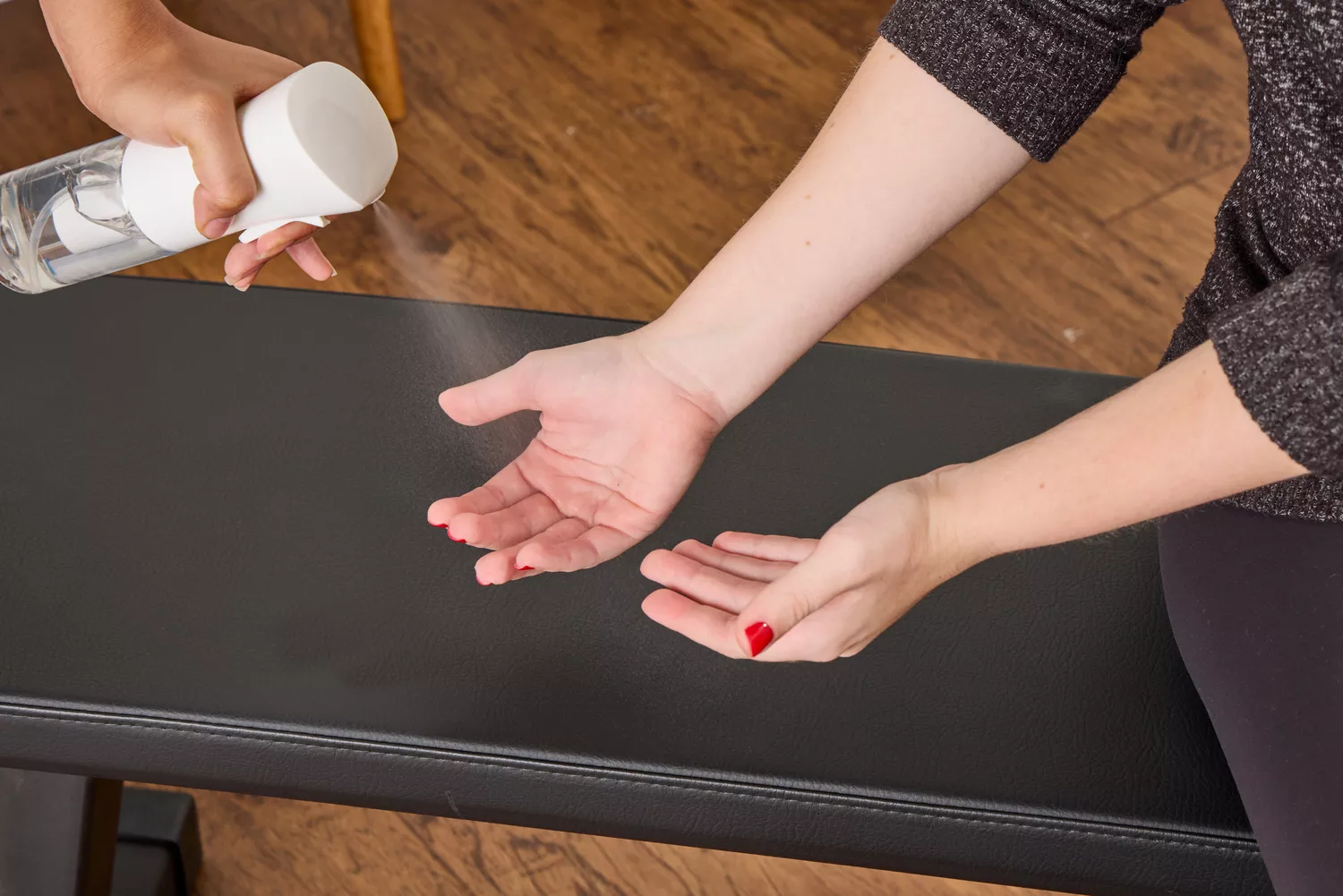 A person prepares to lift the All in Motion 25 lb Adjustable Dumbbells