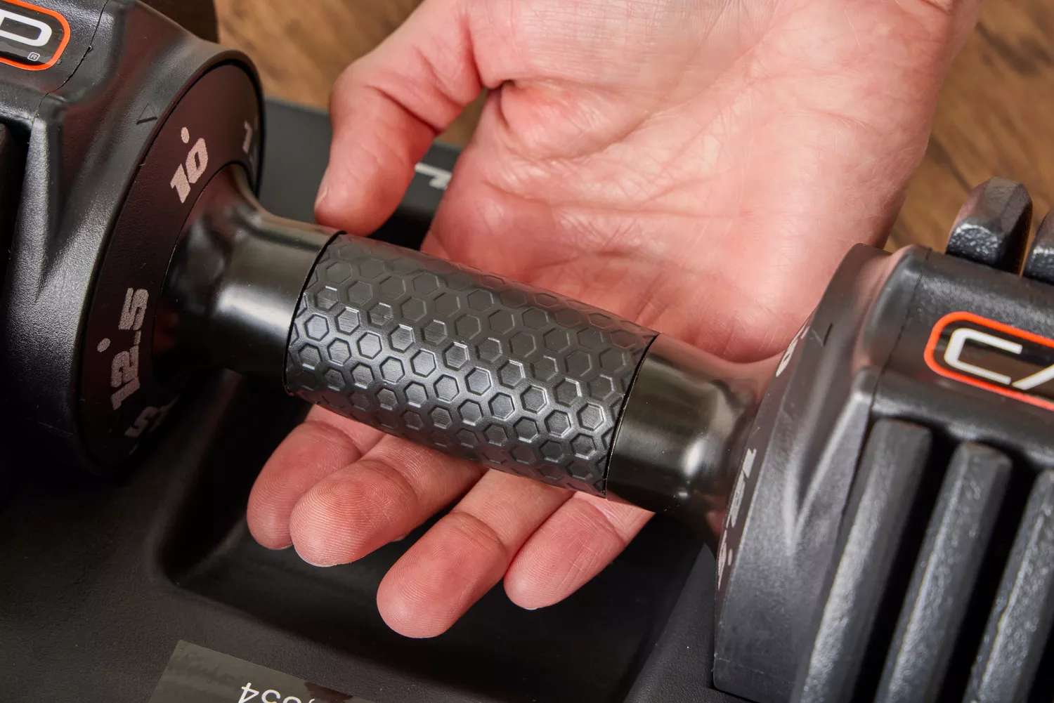 The pattern on the CAP Barbell 25 lb. Adjustable Dumbbell grips