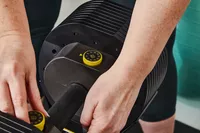 Hand adjusting weight on MX55 Rapid Change Adjustable Dumbbells 