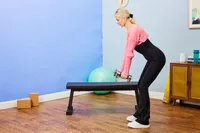 A person lifts Northdeer Steel Dumbbells Ultracompact & Adjustable Chrome Dumbbells during their workout