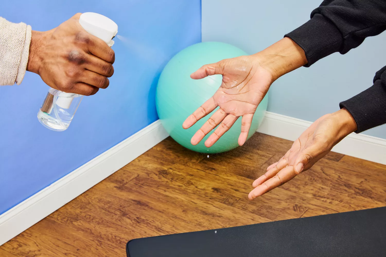 spraying hands for a sweat-test to assess grip 