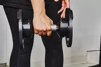 Hand holding Nuobell Adjustable Dumbbell