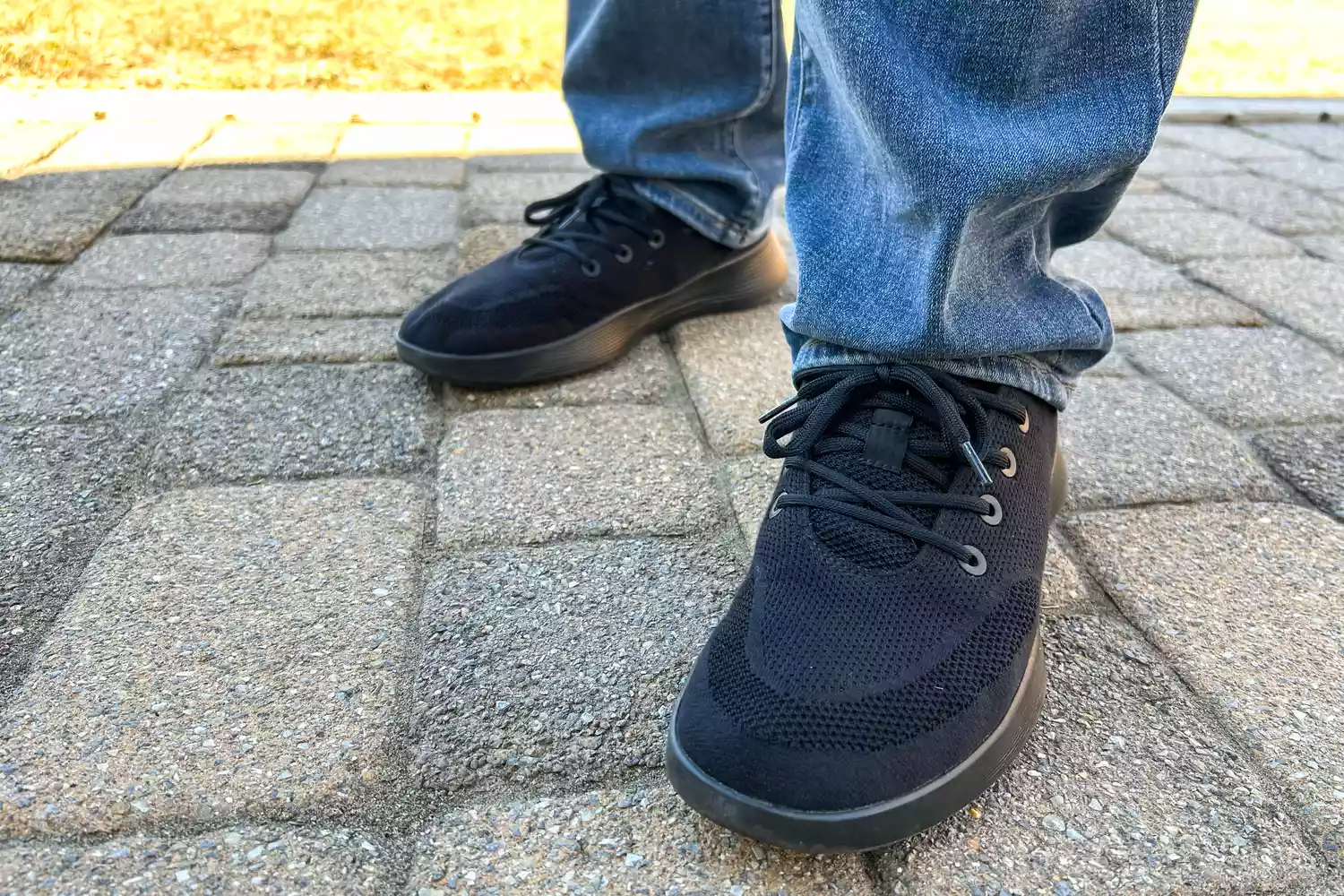 A close-up of the Allbirds Men's Tree Runner Go worn on stones