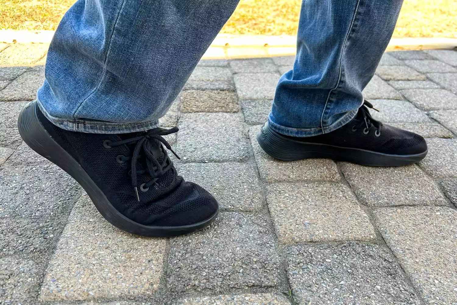 A close-up of the Allbirds Men's Tree Runner Go worn on stone