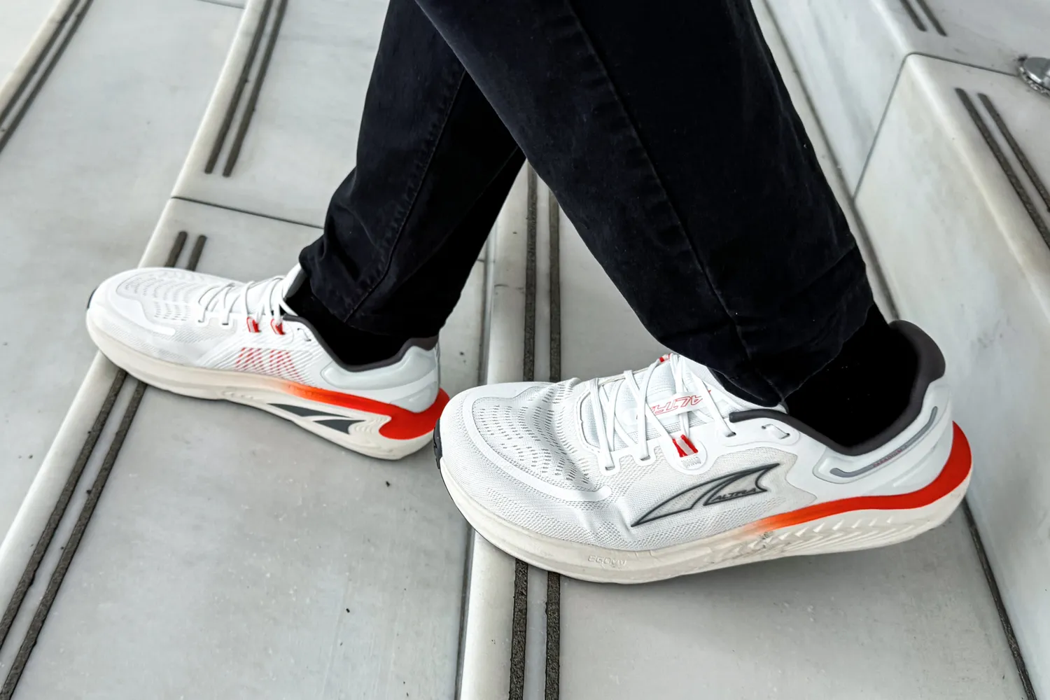 A side view of a person wearing the Altra Men's Paradigm 7 Sneakers