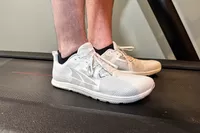 Two feet posed from the side on a treadmill while wearing the Altra Men's Solstice XT 3
